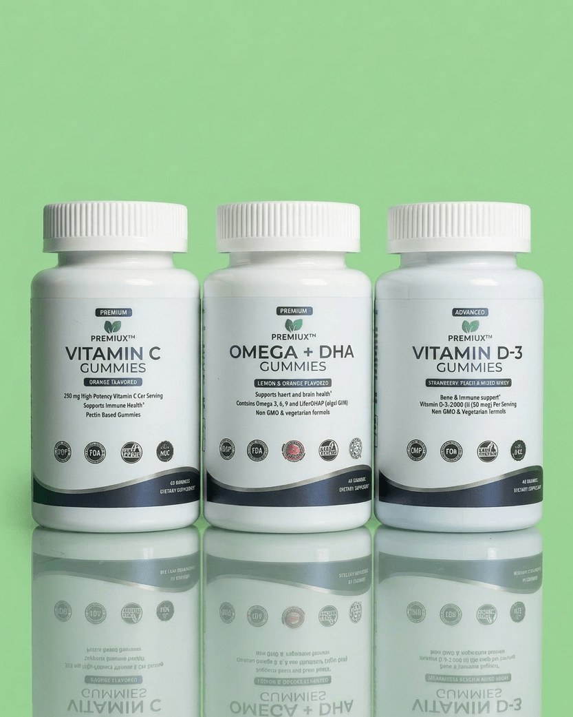 The Family Essentials — One Halal Set for the Whole House (Vitamin C + D + Omega-3) - Premiux NutritionThree white supplement bottles of PrimeGreen brand gummies arranged side by side on a reflective surface against a light green background. The bottles are labeled Vitamin C Gummies, Omega + DHA Gummies, and Vitamin D-3 Gummies.