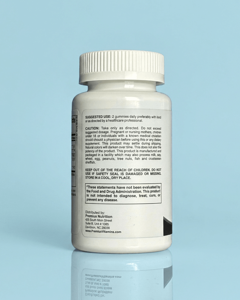 Premiux Vitamin C Gummies 250mg — Immune Defence - Premiux NutritionA white plastic supplement bottle shown from the back, featuring a white ribbed cap and a white label with black text, set against a light blue background with a soft reflection below.199874435411